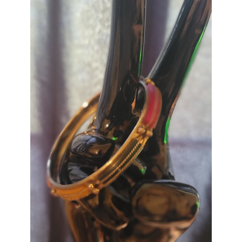 Colorful gold toned bangle with colorful faux stones